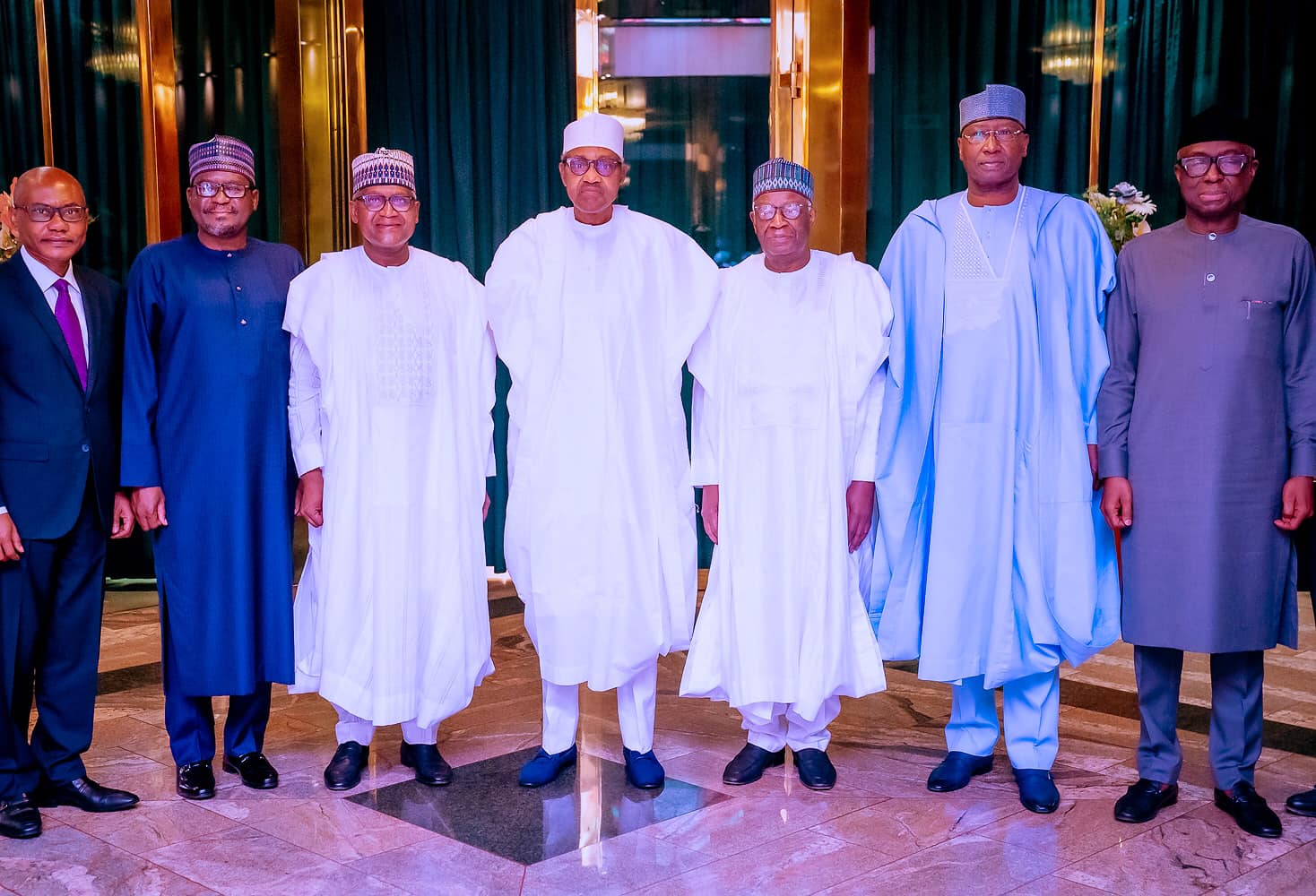 PRESIDENT BUHARI GREETS GM/CEO OF NATIONAL THEATRE, PROF. SUNDAY ENESSI ODODO AT 60